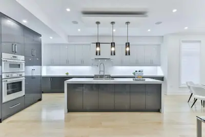 A newly fitted kitchen with a marble island